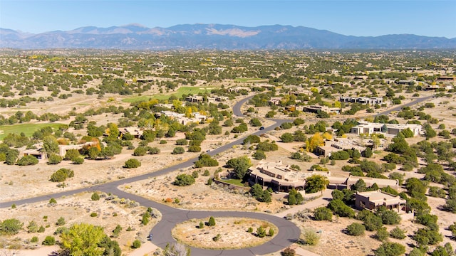 birds eye view of property featuring a mountain view