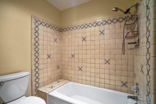 bathroom featuring toilet and bathtub / shower combination