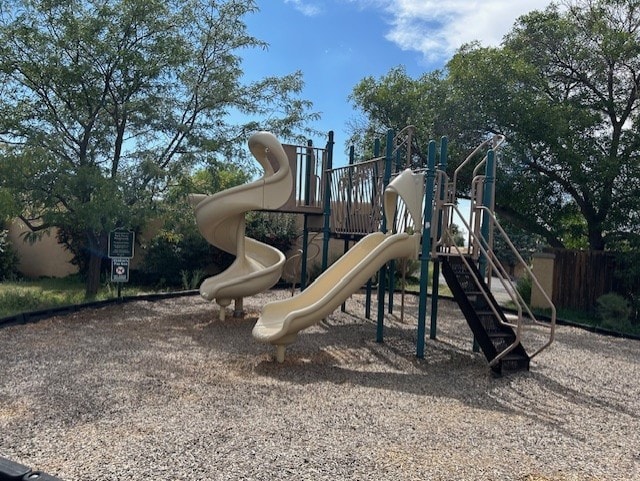 community jungle gym featuring fence