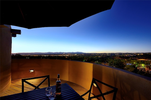 view of balcony at dusk