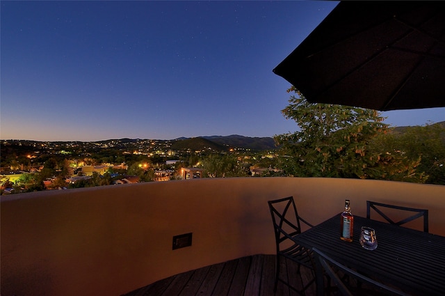 view of balcony at dusk