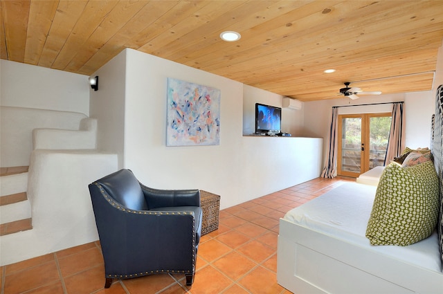 tiled living room with wooden ceiling, french doors, and ceiling fan