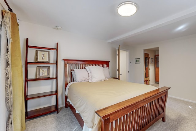 bedroom with carpet and baseboards