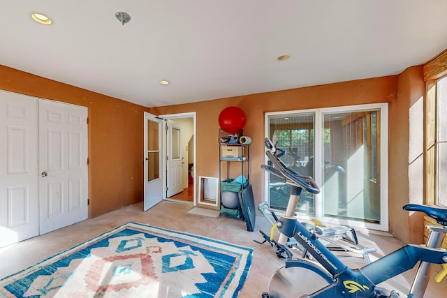 exercise room with recessed lighting