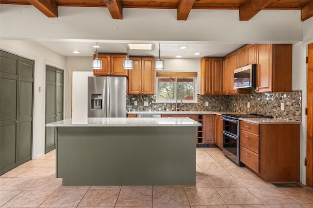 kitchen featuring pendant lighting, tasteful backsplash, stainless steel appliances, a kitchen island, and light stone countertops