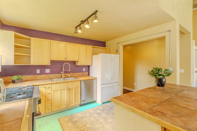 kitchen with tile counters, dishwasher, sink, light brown cabinets, and white refrigerator