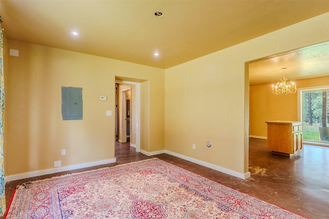 spare room with electric panel and a chandelier