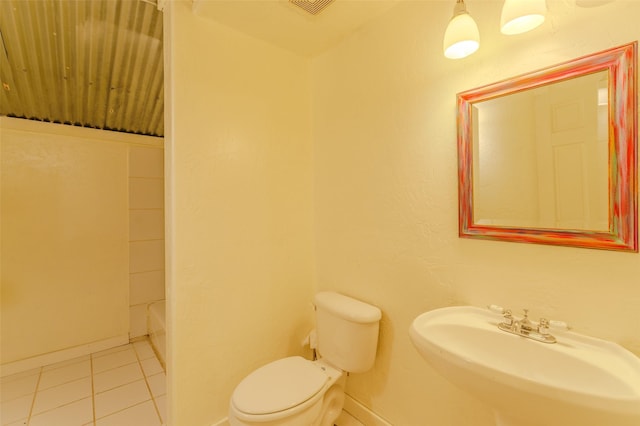 bathroom with tile patterned floors, toilet, and sink