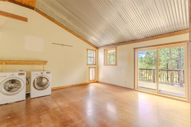 laundry room featuring washing machine and clothes dryer and a wealth of natural light