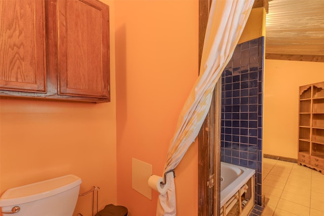 bathroom with tile patterned floors, toilet, and shower / bathtub combination with curtain