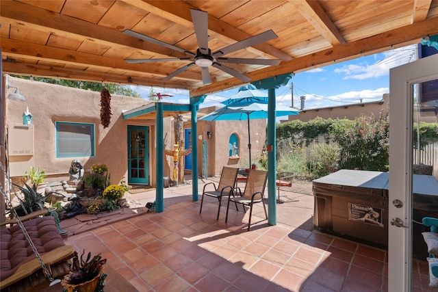 view of patio featuring ceiling fan