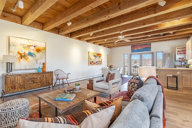 living room with light hardwood / wood-style flooring, ceiling fan, wooden ceiling, french doors, and beamed ceiling