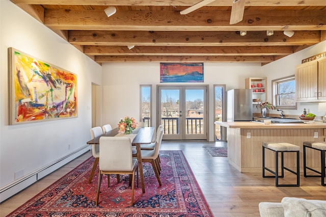 dining area featuring baseboard heating, beam ceiling, wooden ceiling, french doors, and light wood-type flooring