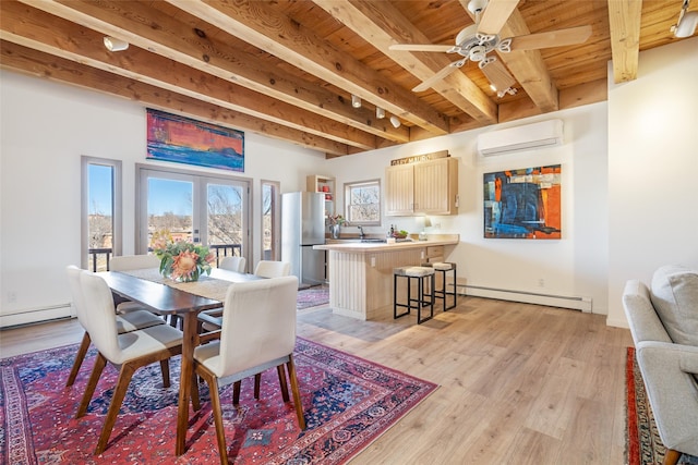 dining room with beam ceiling, light hardwood / wood-style floors, french doors, a baseboard radiator, and an AC wall unit