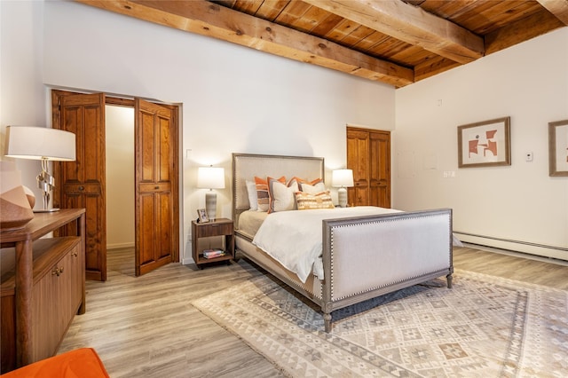 bedroom with a baseboard heating unit, wood ceiling, beamed ceiling, and light wood-type flooring