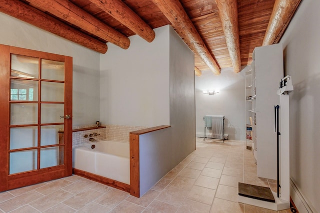 bathroom with beamed ceiling, wood ceiling, tile patterned flooring, and a tub