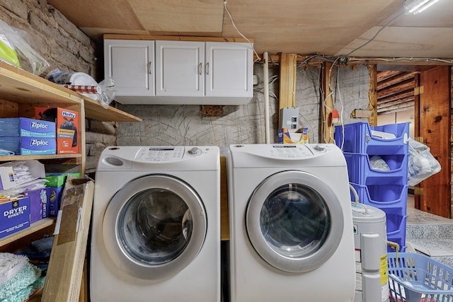 washroom with washing machine and clothes dryer