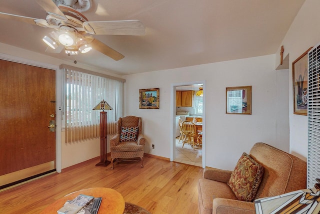 interior space featuring light hardwood / wood-style floors and ceiling fan