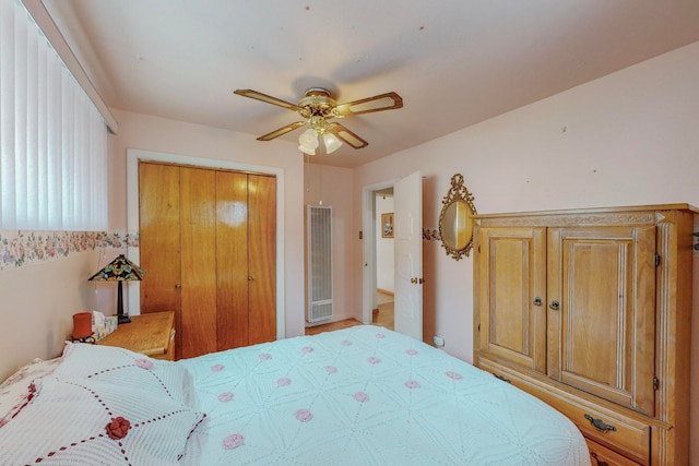 bedroom with ceiling fan and a closet