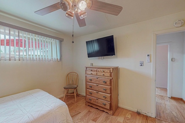 bedroom featuring ceiling fan and hardwood / wood-style flooring