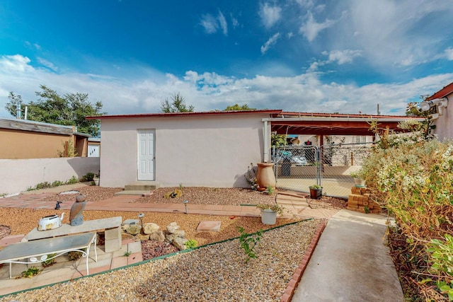 rear view of house with a carport