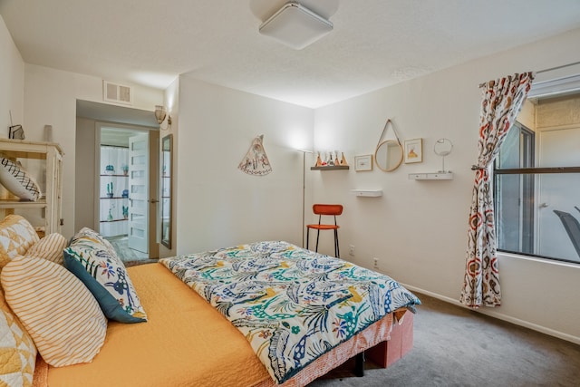 carpeted bedroom featuring connected bathroom