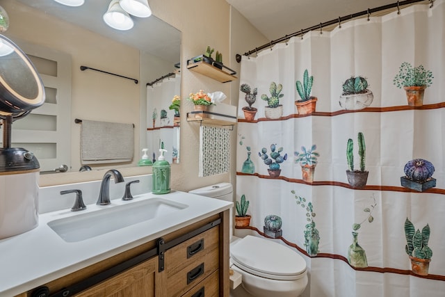 bathroom featuring a shower with curtain, vanity, and toilet