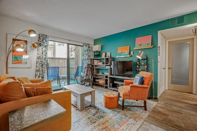 living room with light hardwood / wood-style floors