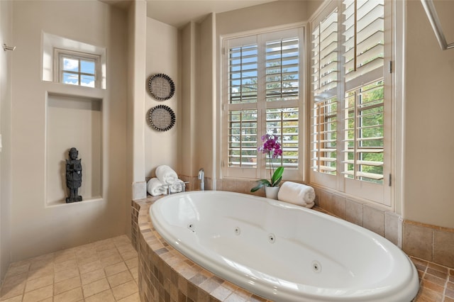 bathroom featuring tiled bath and tile patterned floors