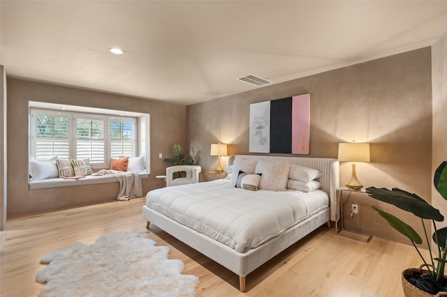 bedroom with light wood-type flooring