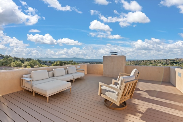 wooden deck with an outdoor hangout area