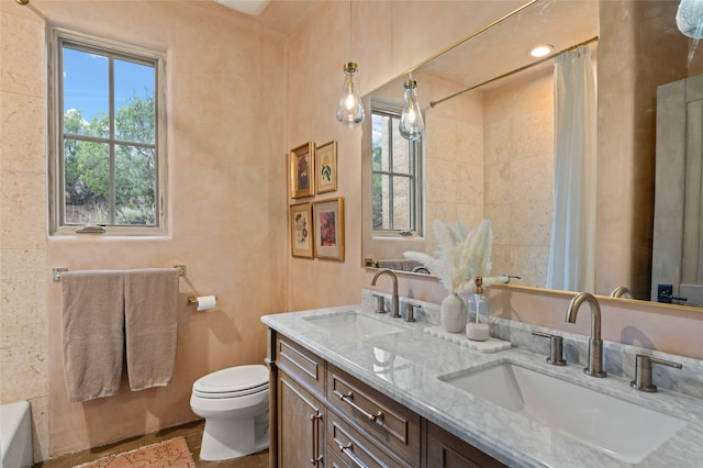 full bathroom with shower with separate bathtub, vanity, and toilet