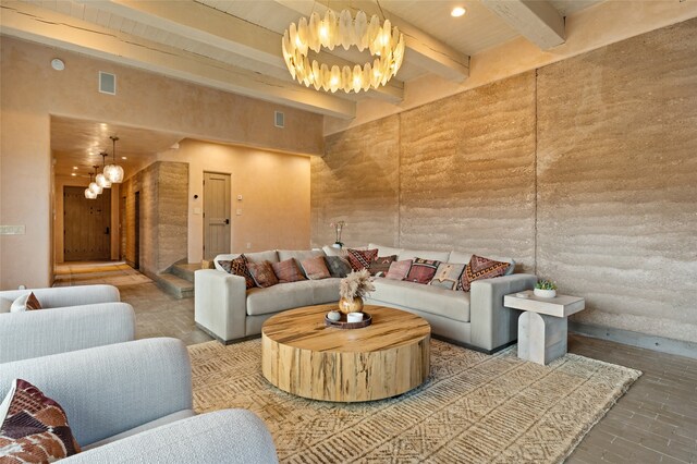 living room with wood-type flooring, a high ceiling, and beam ceiling