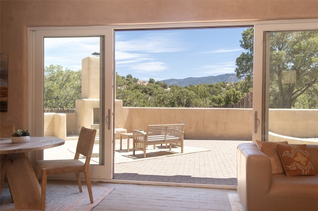 doorway to outside featuring a mountain view