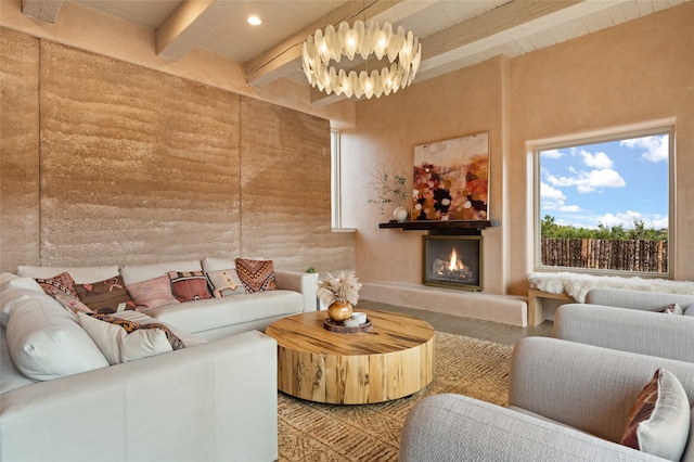 23 Lavadero Rd, Santa Fe, NM 87506 - living area featuring beam ceiling, a notable chandelier, recessed lighting, and a warm lit fireplace
