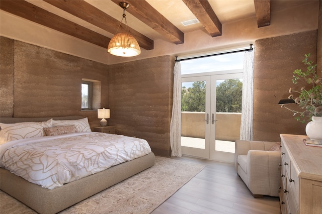 bedroom featuring light hardwood / wood-style floors, beam ceiling, french doors, access to outside, and rustic walls