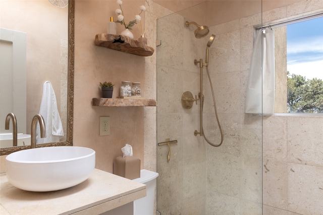 bathroom featuring vanity and tiled shower