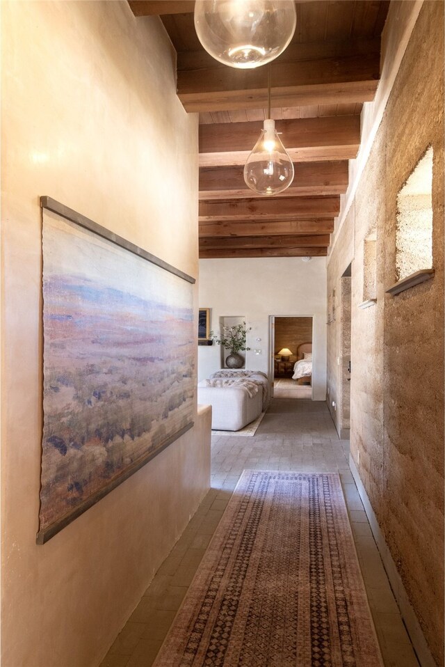 hallway with beam ceiling and wooden ceiling