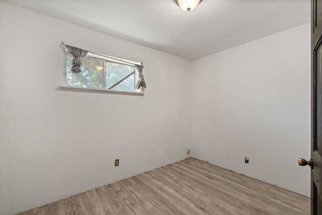 unfurnished room with light hardwood / wood-style flooring