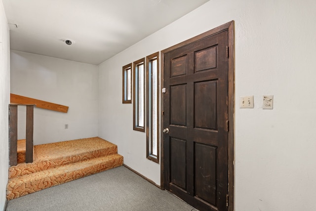 view of carpeted entrance foyer