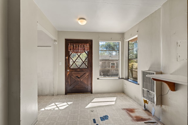 foyer entrance featuring heating unit