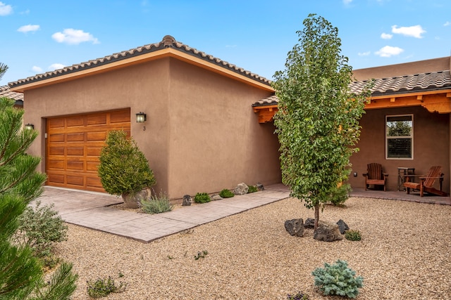 view of side of property with a garage