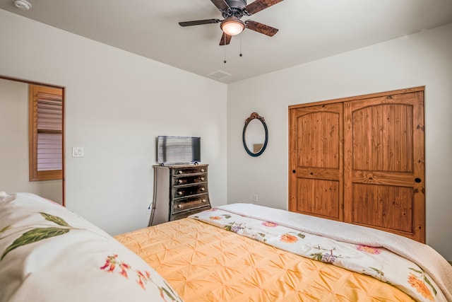 bedroom featuring visible vents and a ceiling fan