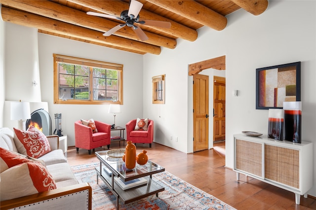 living room with beam ceiling, ceiling fan, wooden ceiling, and hardwood / wood-style floors