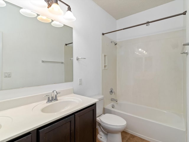 full bathroom with double vanity, toilet, tile patterned floors, tub / shower combination, and a sink