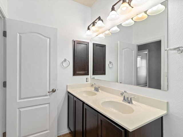 bathroom with double vanity and a sink