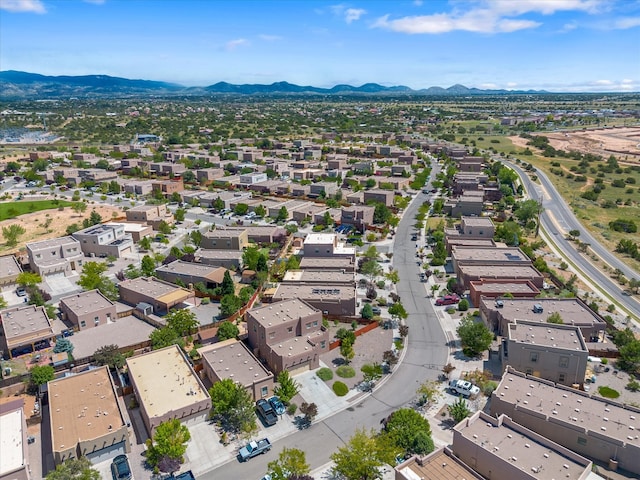 birds eye view of property with a mountain view and a residential view