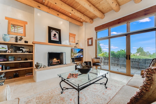 living room with wood ceiling, beam ceiling, and light tile patterned floors