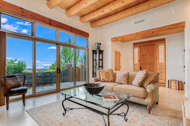 living room featuring beam ceiling, wooden ceiling, and light tile patterned flooring