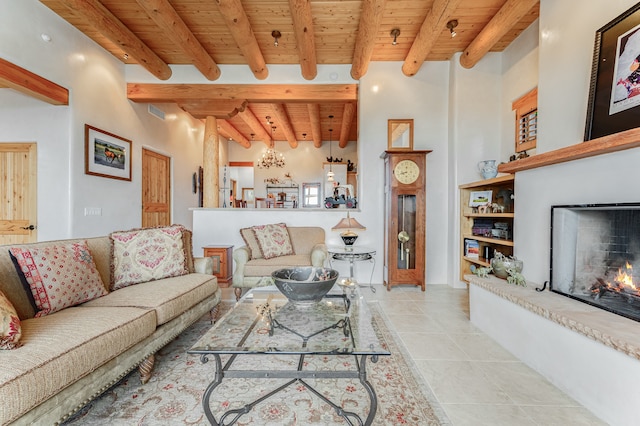 living room with wooden ceiling, light tile patterned floors, and beamed ceiling